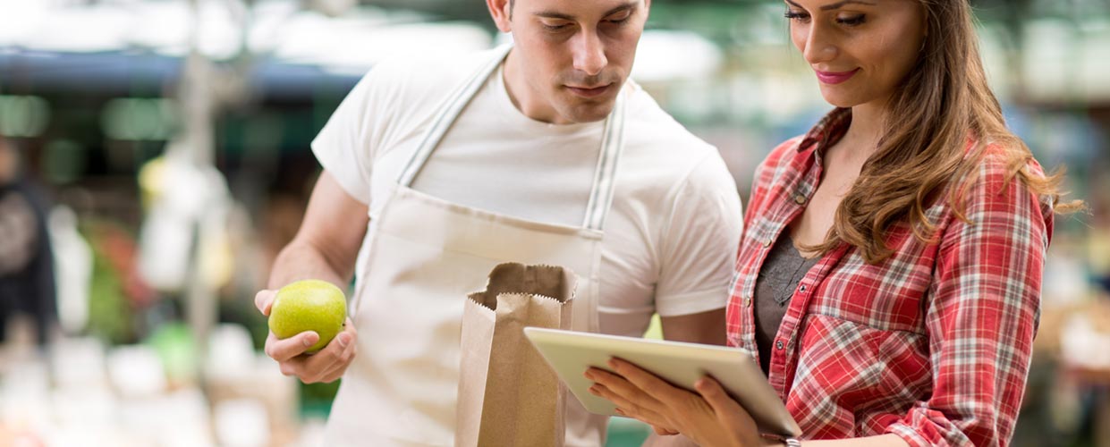 Store Employee helping shopper