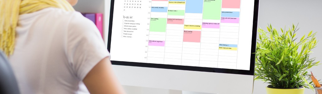 Woman scheduling shifts via computer